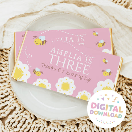 Pink bee themed chocolate bar wrapper with children text and bee icons