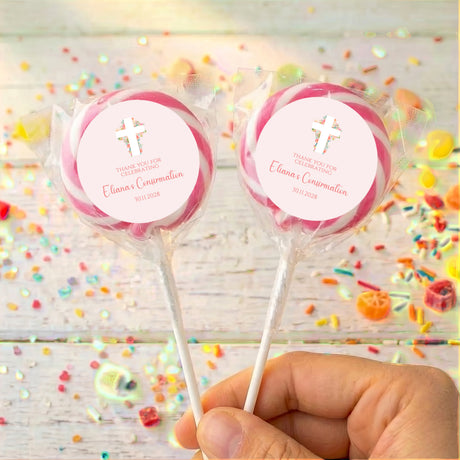 Personalised lollipops with pink swirl wrappers, cross and thank-you message on labels