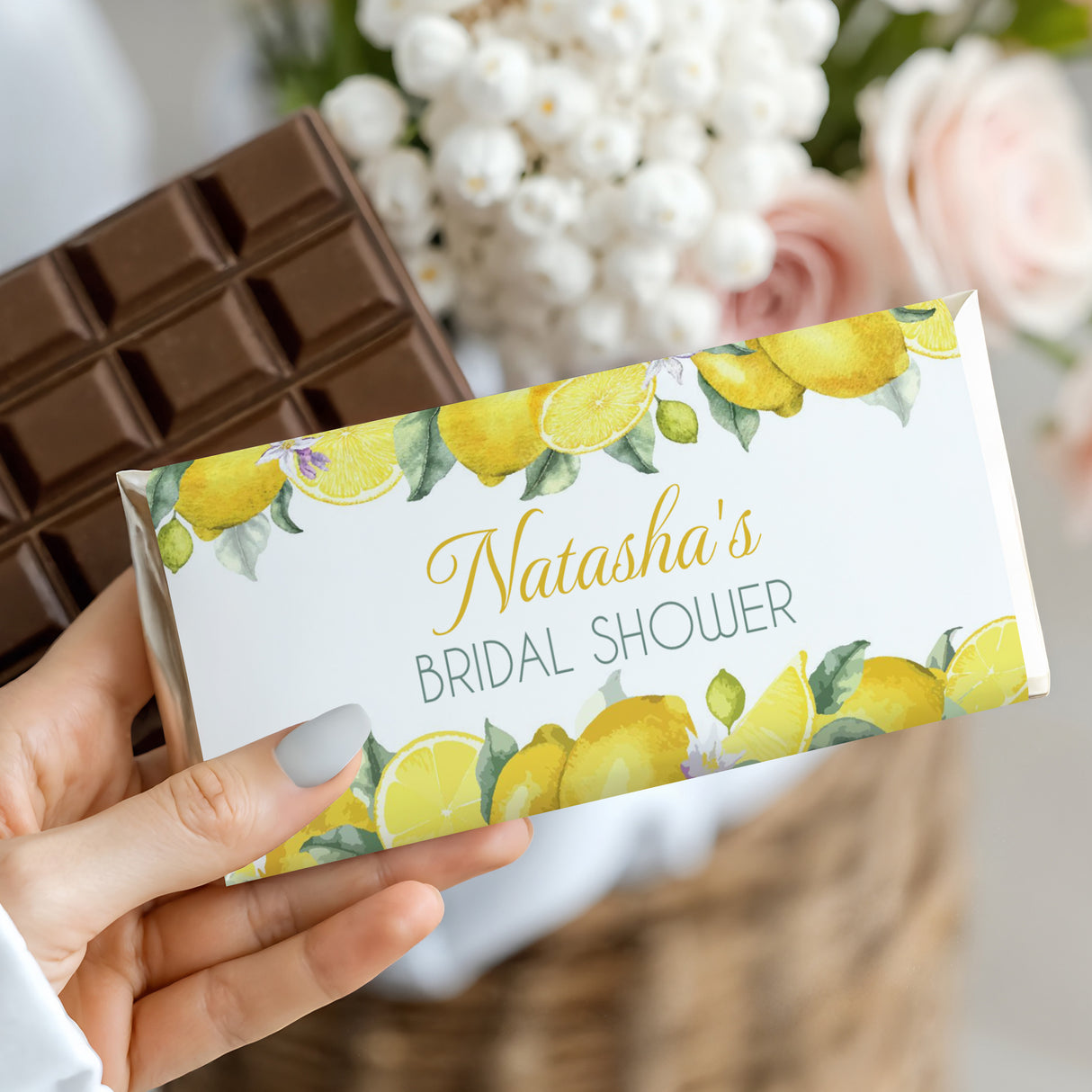 Lemon bridal shower chocolate bar in white wrapper with lemon print and “Natasha’s Bridal Shower”
