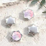 Star-shaped foil chocolates with personalised message cards, silver tones.