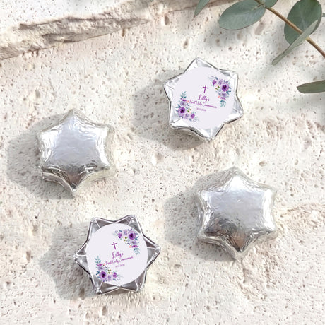 Silver foil chocolate stars with floral cross Communion label on a round centre card