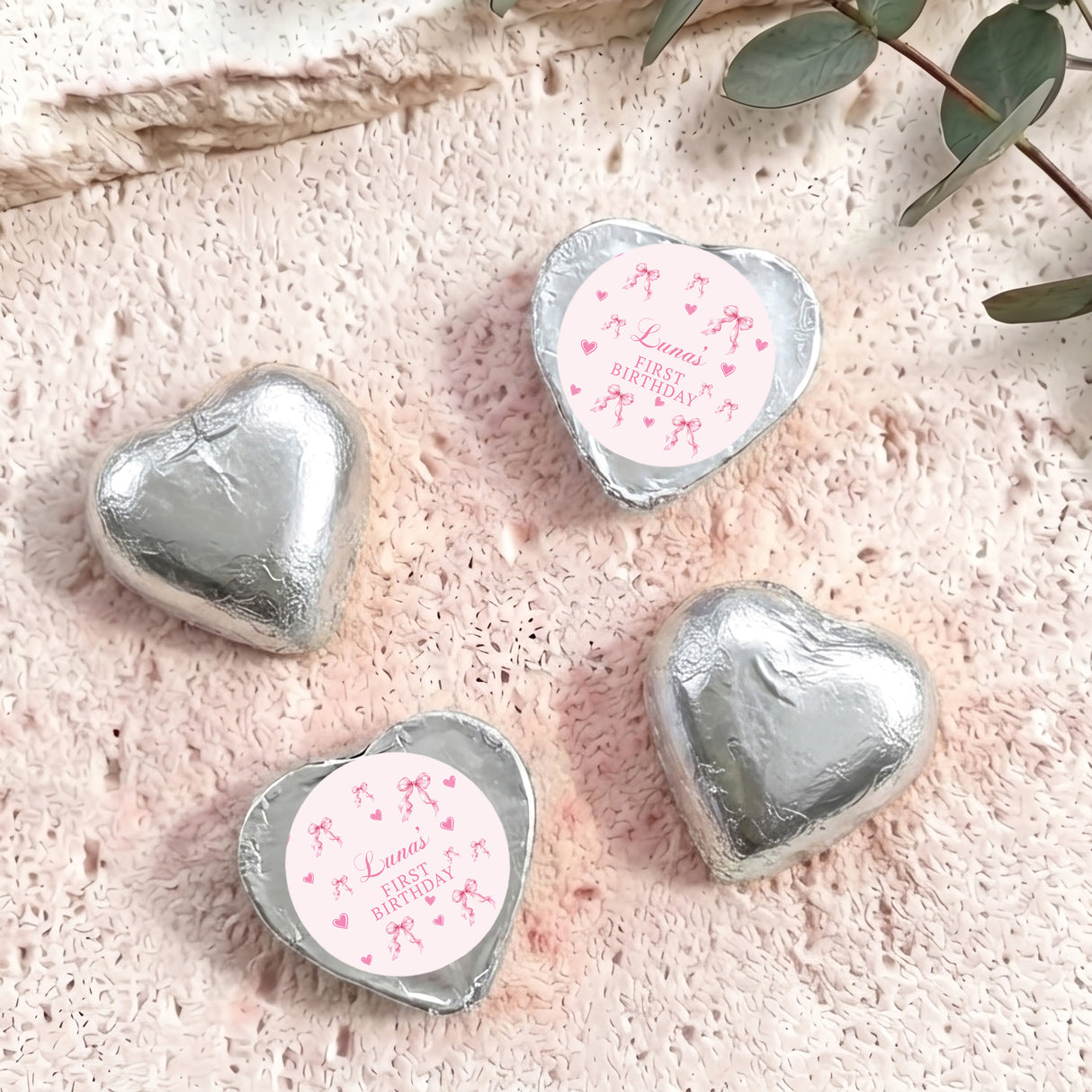Silver foil-covered heart chocolates with round First Birthday label, personalized message