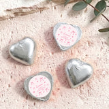Silver foil-covered heart chocolates with round First Birthday label, personalized message