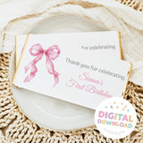 Chocolate bar wrapper with pink bow and 'Thank you for celebrating' text