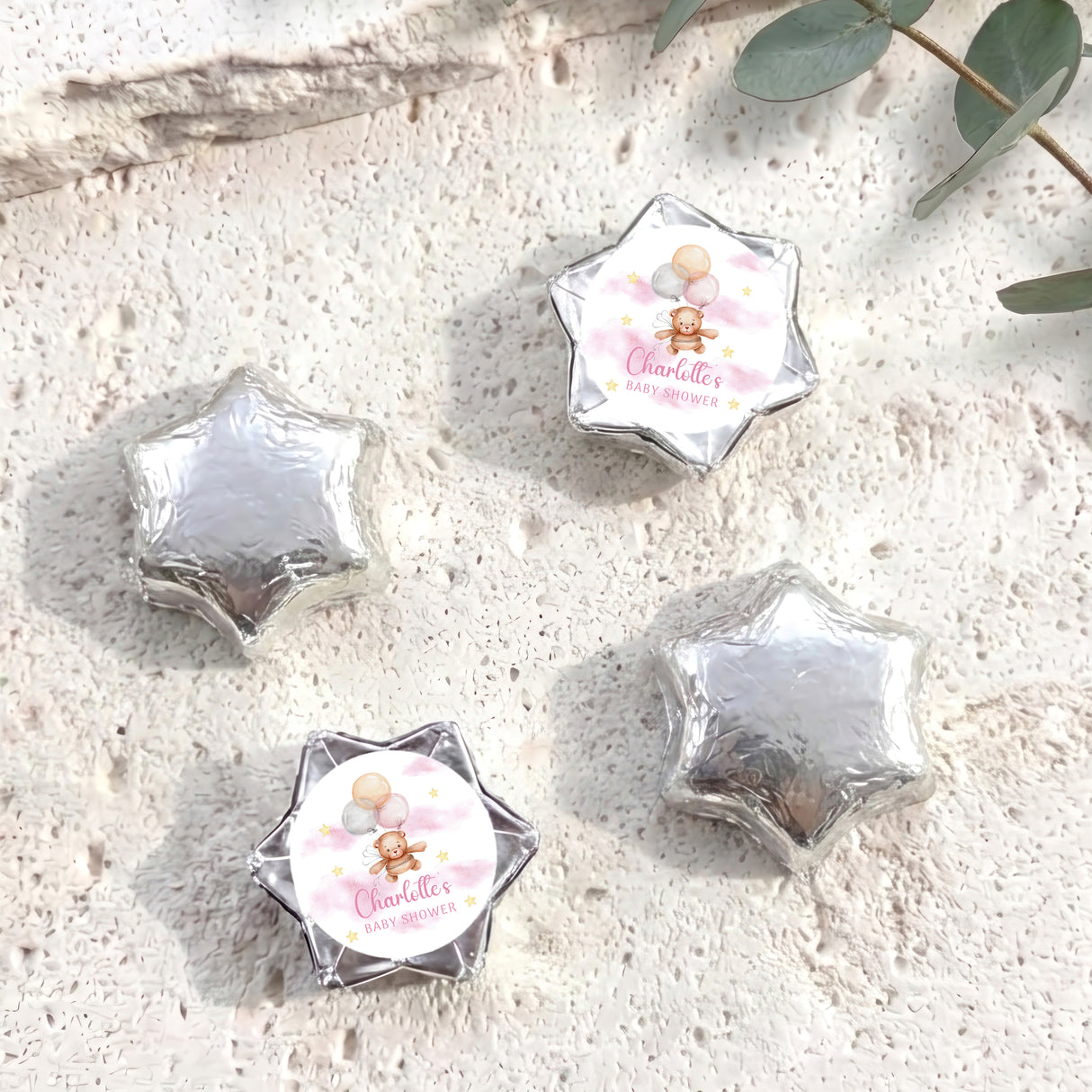 Silver star-shaped foil balloons with 'Charlotte's Baby Shower' teddy design