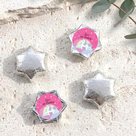 Silver star-shaped foil chocolate with “Zara’s 6th Birthday” unicorn rainbow label