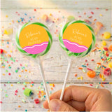 Personalised 40th birthday lollipops with green-wrapped sticks and yellow-pink round labels