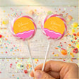 Personalised 40th birthday lollipops with pink-and-orange round labels on clear sticks