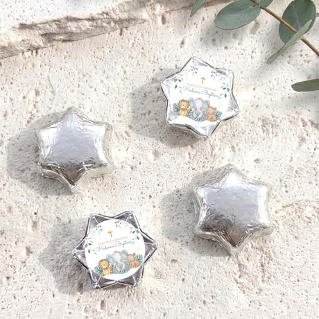 Foil-covered chocolate stars in silver with a printed animal baptism topper