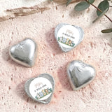 Silver foil-covered chocolate hearts with white labels reading “A WILD ONE”.