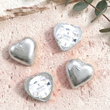 Foil-covered chocolate hearts in silver with personalized label