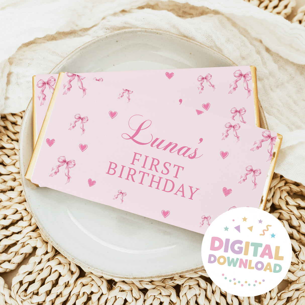 Pink chocolate bar wrapper with bows, hearts, and 'Luna's First Birthday'