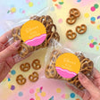 Personalised birthday pretzel snack bag with brown pretzels and round pink-yellow label