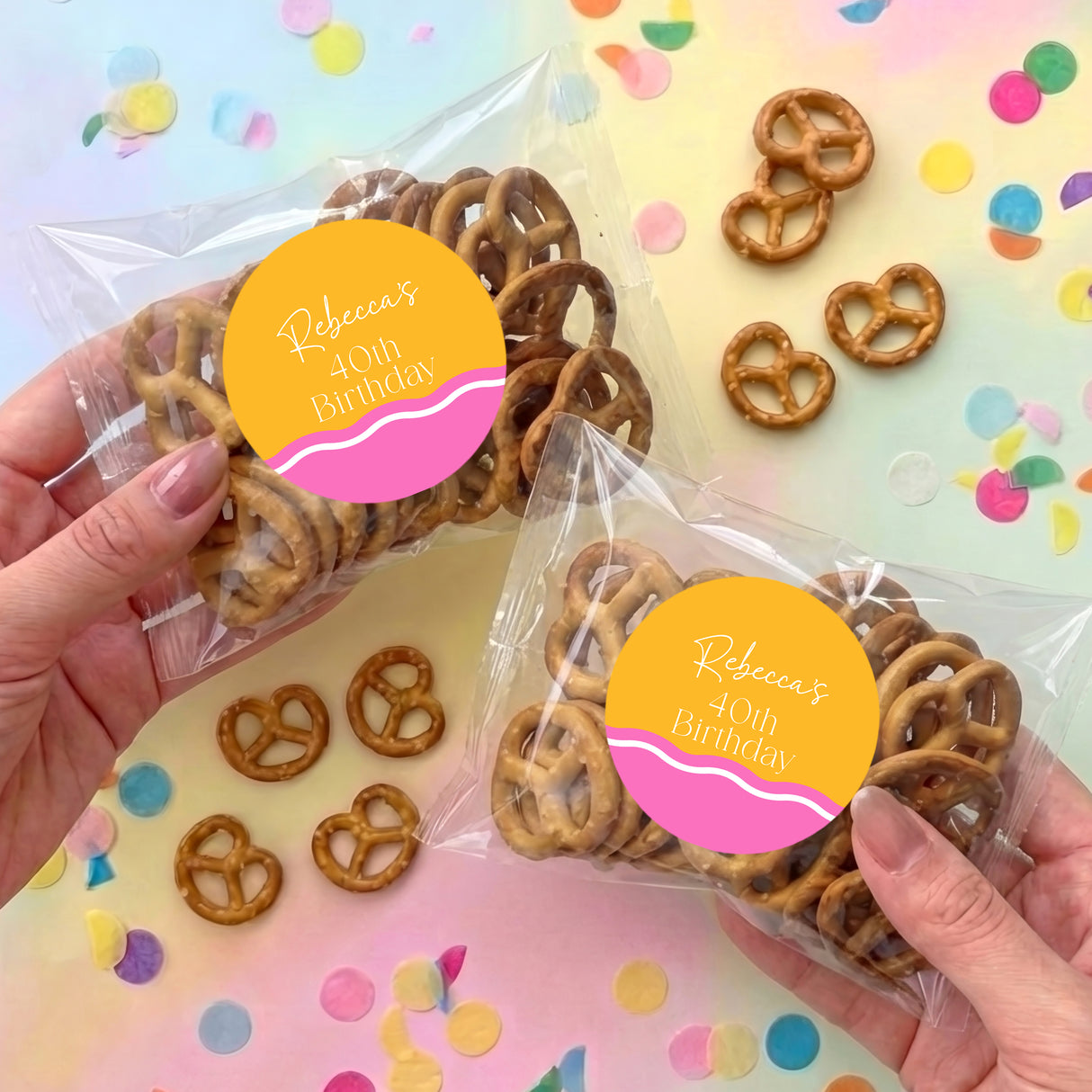Personalised birthday pretzel snack bag with brown pretzels and round pink-yellow label