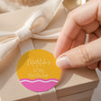 Wavy round kids birthday label: “Matilda’s 10th Birthday”, yellow and pink