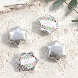 Silver foil-covered chocolate star sweets with floral personalized wrappers