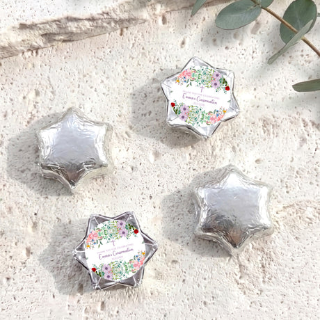 Foil-covered chocolate star sweets with floral personalised label, silver foil stars