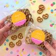 Personalised bridal shower pretzel bags with brown pretzels and round label