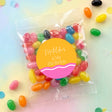 Personalised kids birthday jelly bean bag with multicolored candy and round name label