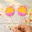 Personalised lollipops with pink wavy Happy Mother's Day labels on clear wrappers