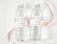 Clear plastic water bottles with mauve marble personalized labels and caps