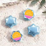 Blue foil star chocolates with “Happy Mother’s Day” label, arranged in set.