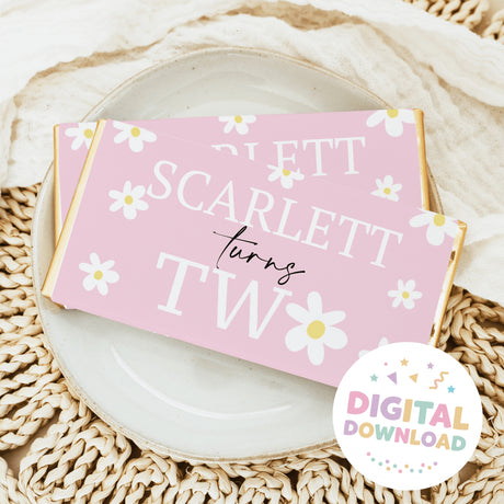 Chocolate bar wrapper in pink with white daisies and gold border