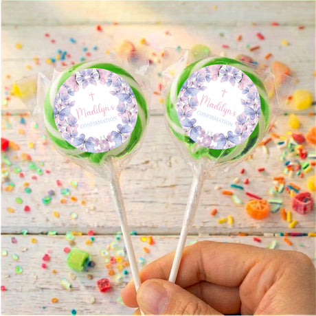 Butterfly-themed confirmation lollipops with green ribbon bows and round printed labels