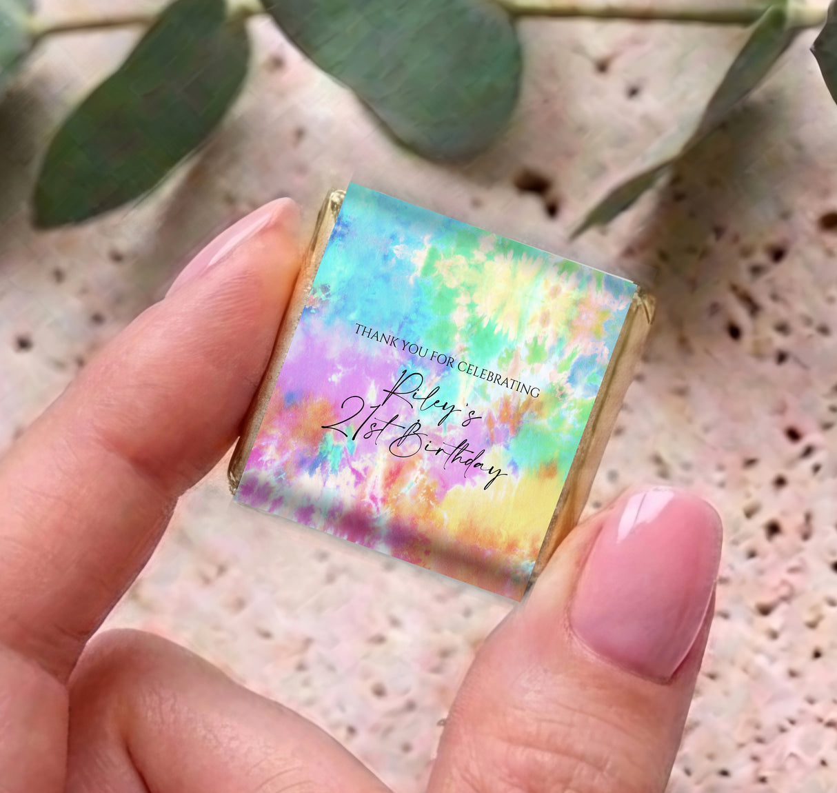 Mini tie-dye wrapped chocolates with birthday personalised message, held in hand