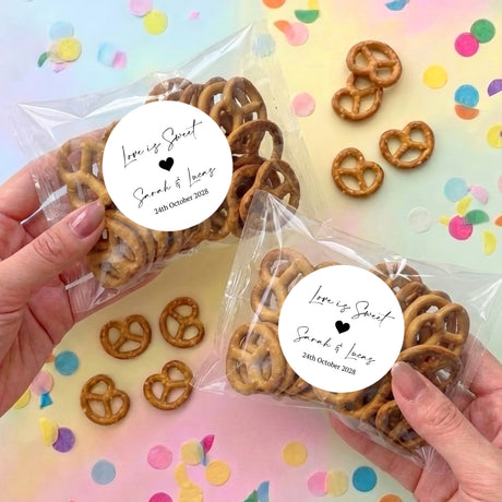 Personalised wedding pretzel gift bags with heart-shaped pretzels and round message stickers