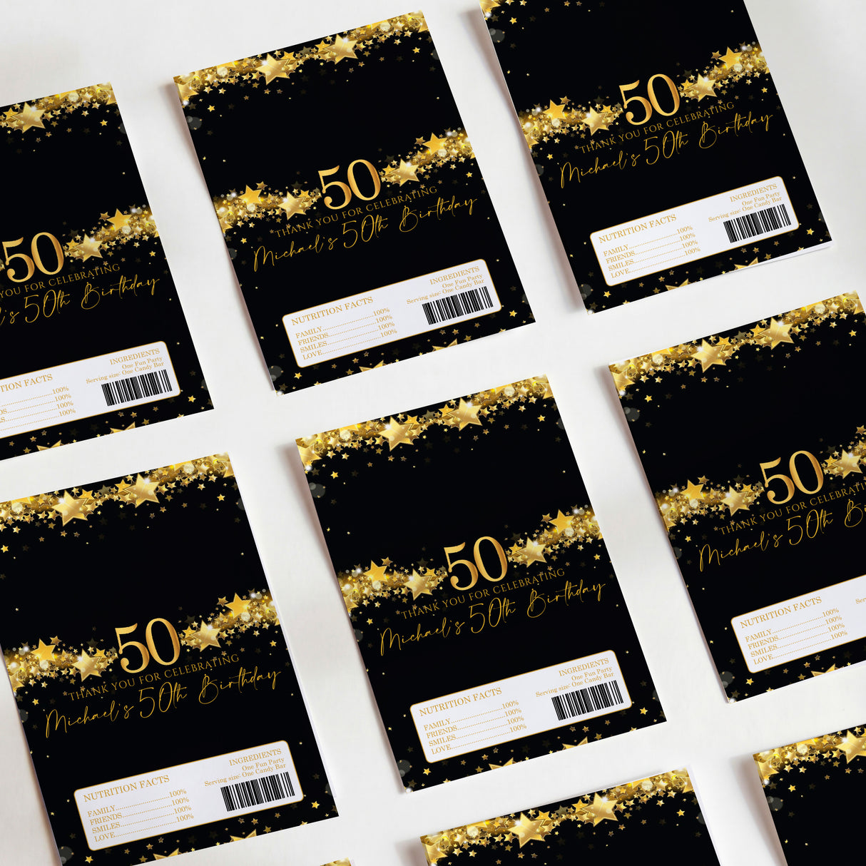 50th birthday chocolate wrappers, black with gold stars and gold “50” print