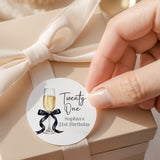 Round white champagne 21st birthday label with champagne flute, 'Twenty One' and name text.