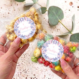 Personalized confirmation popcorn bag with clear plastic and purple butterfly round label