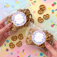 Personalised pretzel bag with pink and purple butterfly label, sealed clear bag