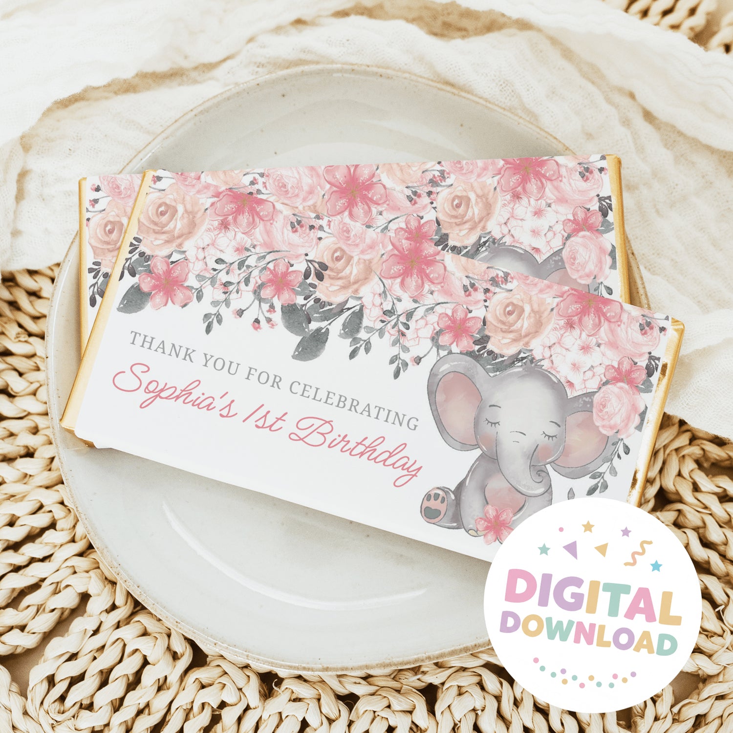 Chocolate bar wrapper with pink florals and elephant graphic, '1st Birthday' text