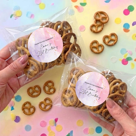 Personalized pretzel bag with clear plastic pack and pink round birthday label