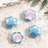 Light blue foil-covered chocolate stars with personalized round label