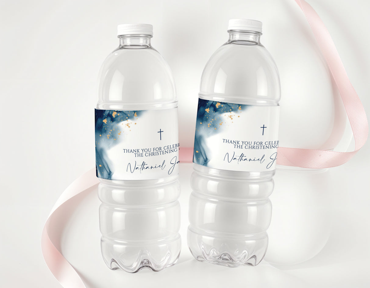 Two clear plastic water bottles with blue christening labels and gold accents