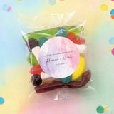 Clear lolly bag with mixed sweets and pink marble thank-you round label