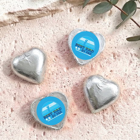 Silver foil-covered chocolate hearts with blue "Best Dad by Par" label