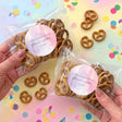 Personalised pretzel bag in clear wrap with brown pretzels and pink round label