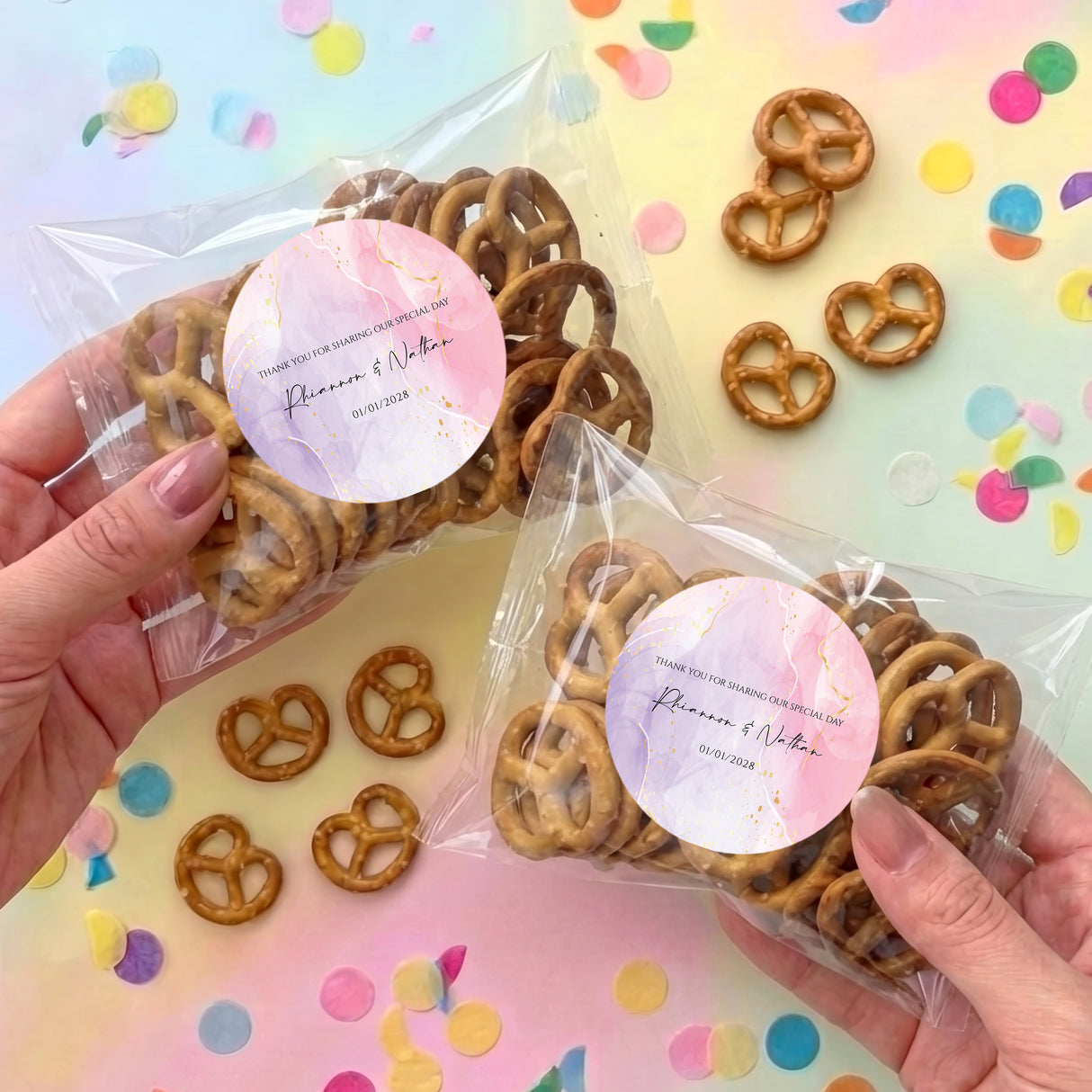 Personalised pretzel bag in clear wrap with brown pretzels and pink round label