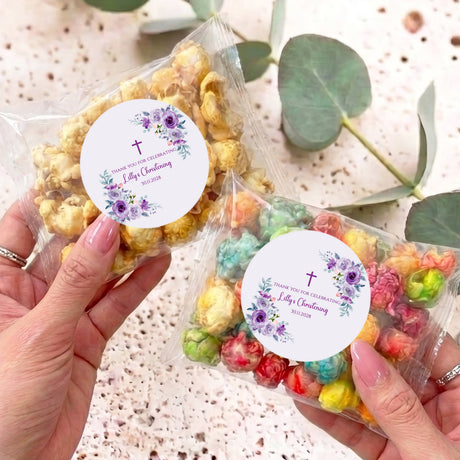 Personalised popcorn bag with clear wrapper, colorful popcorn, and floral round label