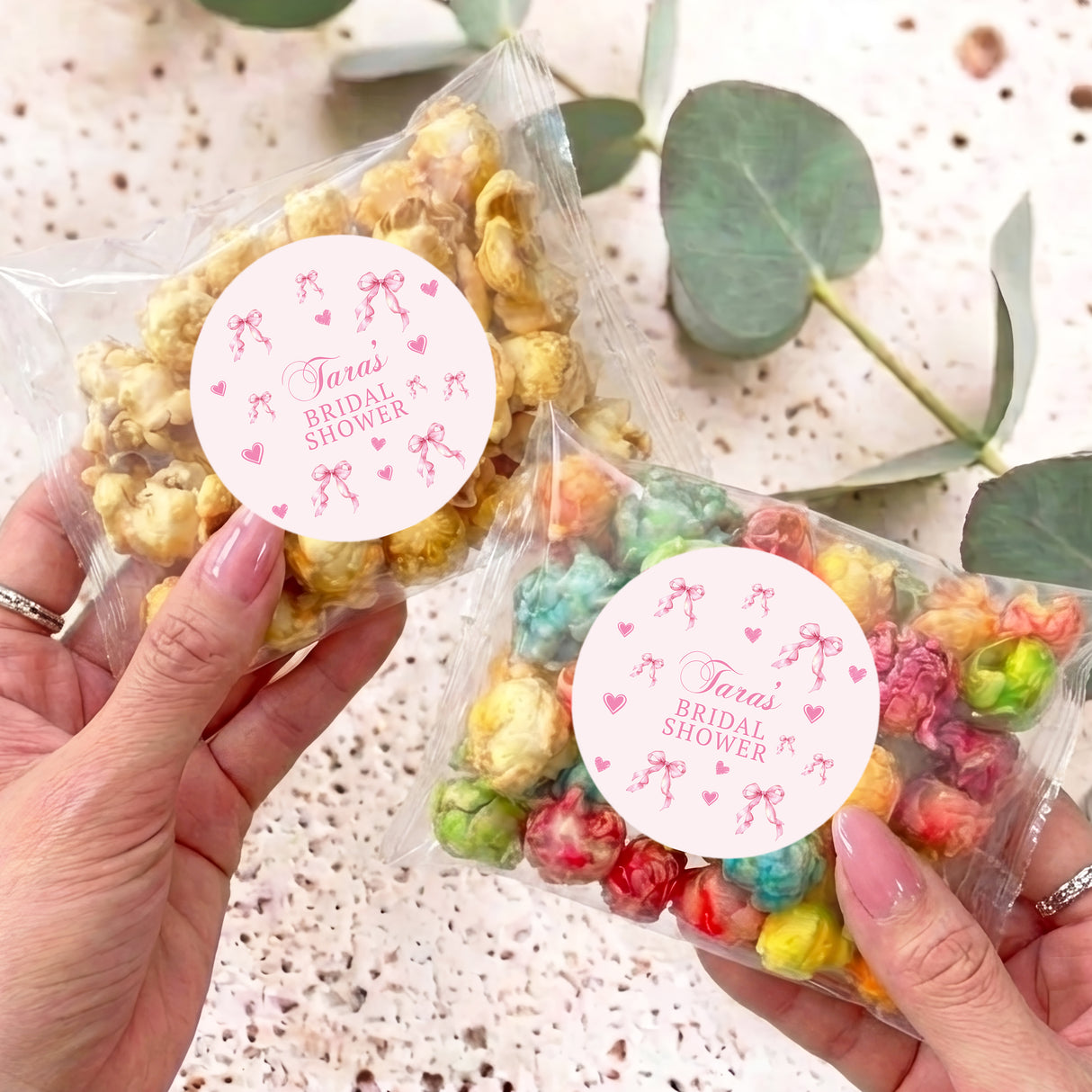 Clear popcorn bag with pink bow tie and round Tara's Bridal Shower label