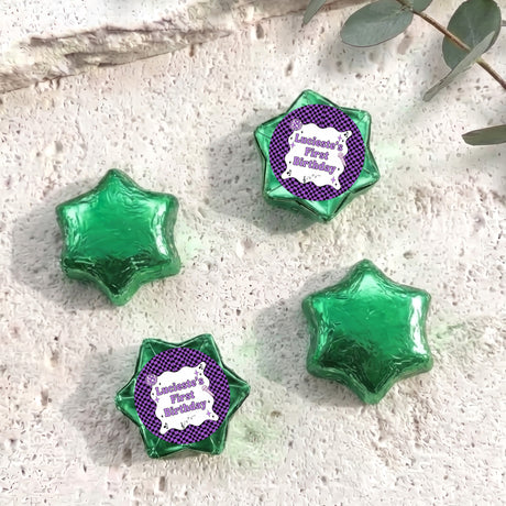 Foil-covered chocolate star candies in green with personalised 'Birthday' topper