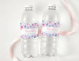 Pastel butterfly drink bottle labels on two clear 4th birthday bottles, Matilda's