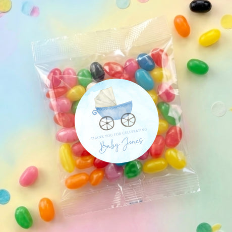 Jelly bean favor bag with round baby carriage thank-you label and assorted candies