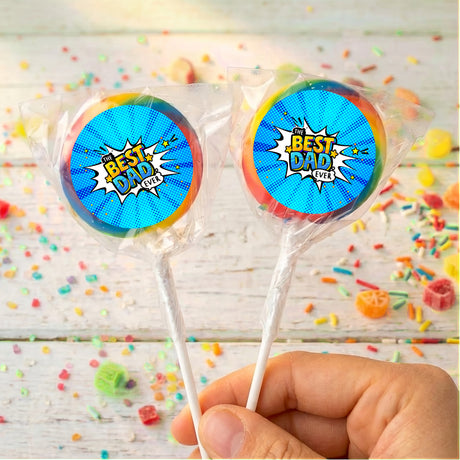 Two blue round lollipops in clear wrappers, comic “Best Dad Ever” label.