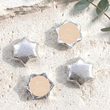 Foil-covered star chocolates with silver finish and round personalized tag