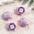 Foil-covered chocolate star candies in light purple with personalised 'Birthday' topper